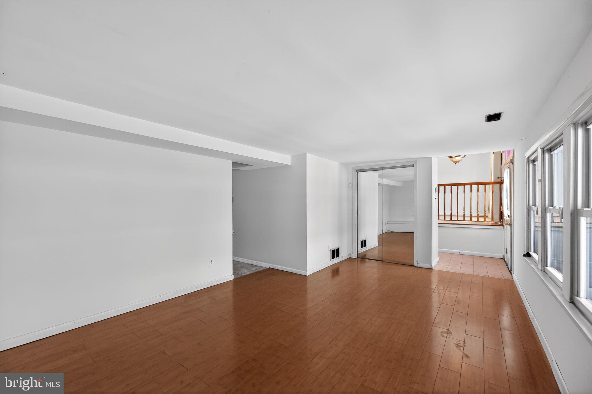 308 Smith Lane Runnemede, NJ 08078 - Photo 13 of 32 a view of an empty room with wooden floor