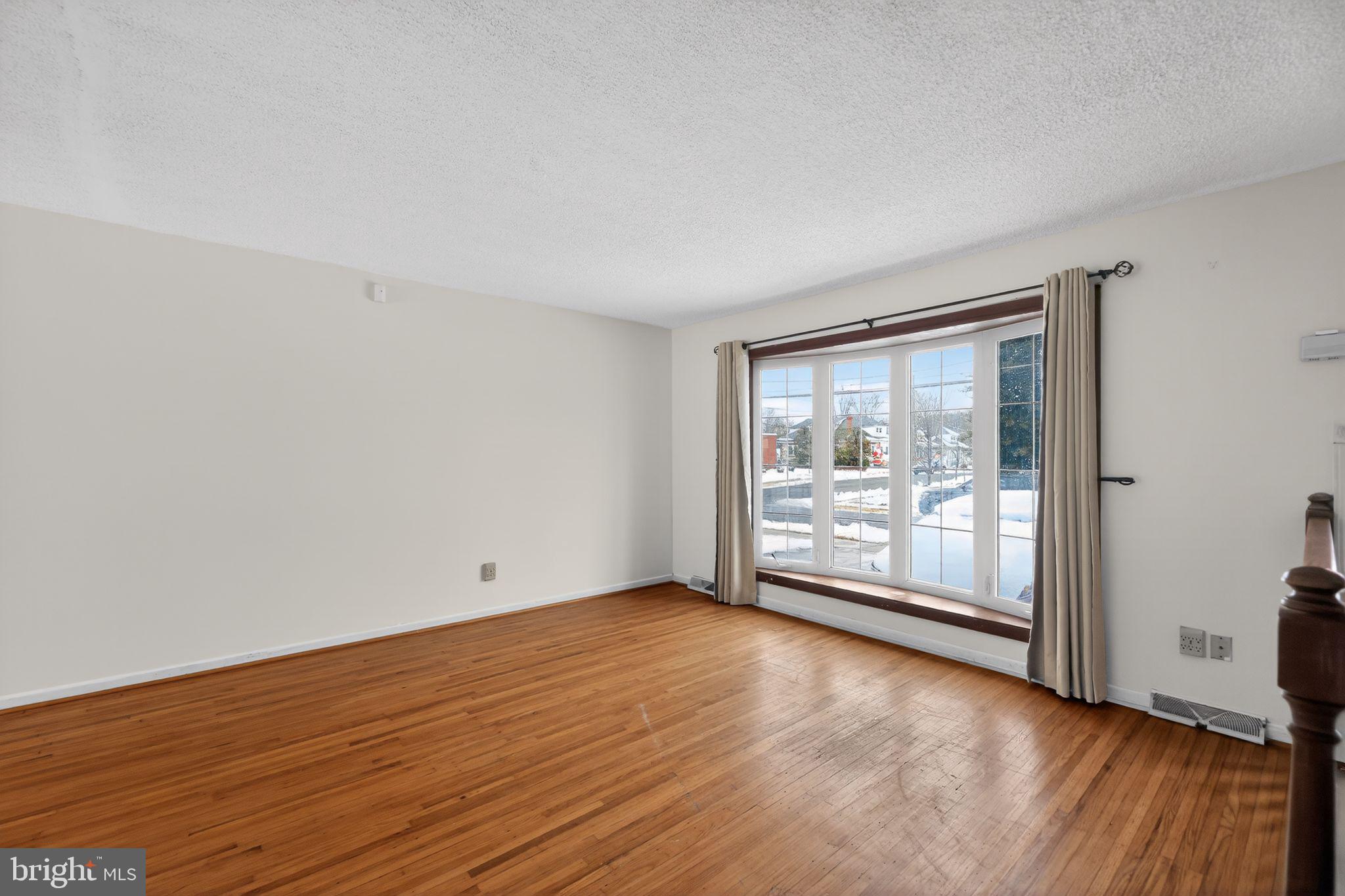 308 Smith Lane Runnemede, NJ 08078 - Photo 15 of 32 wooden floor in an empty room with a window