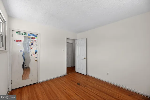 a white toilet sitting next to a bathroom sink and vanity