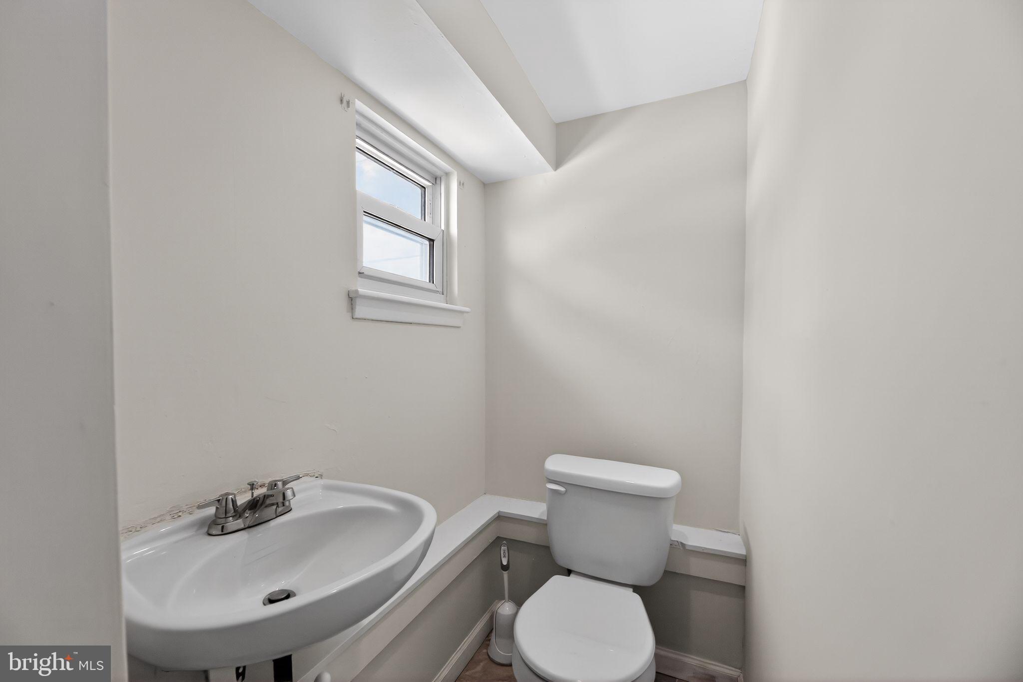 308 Smith Lane Runnemede, NJ 08078 - Photo 19 of 32 a bathroom with a sink mirror and toilet