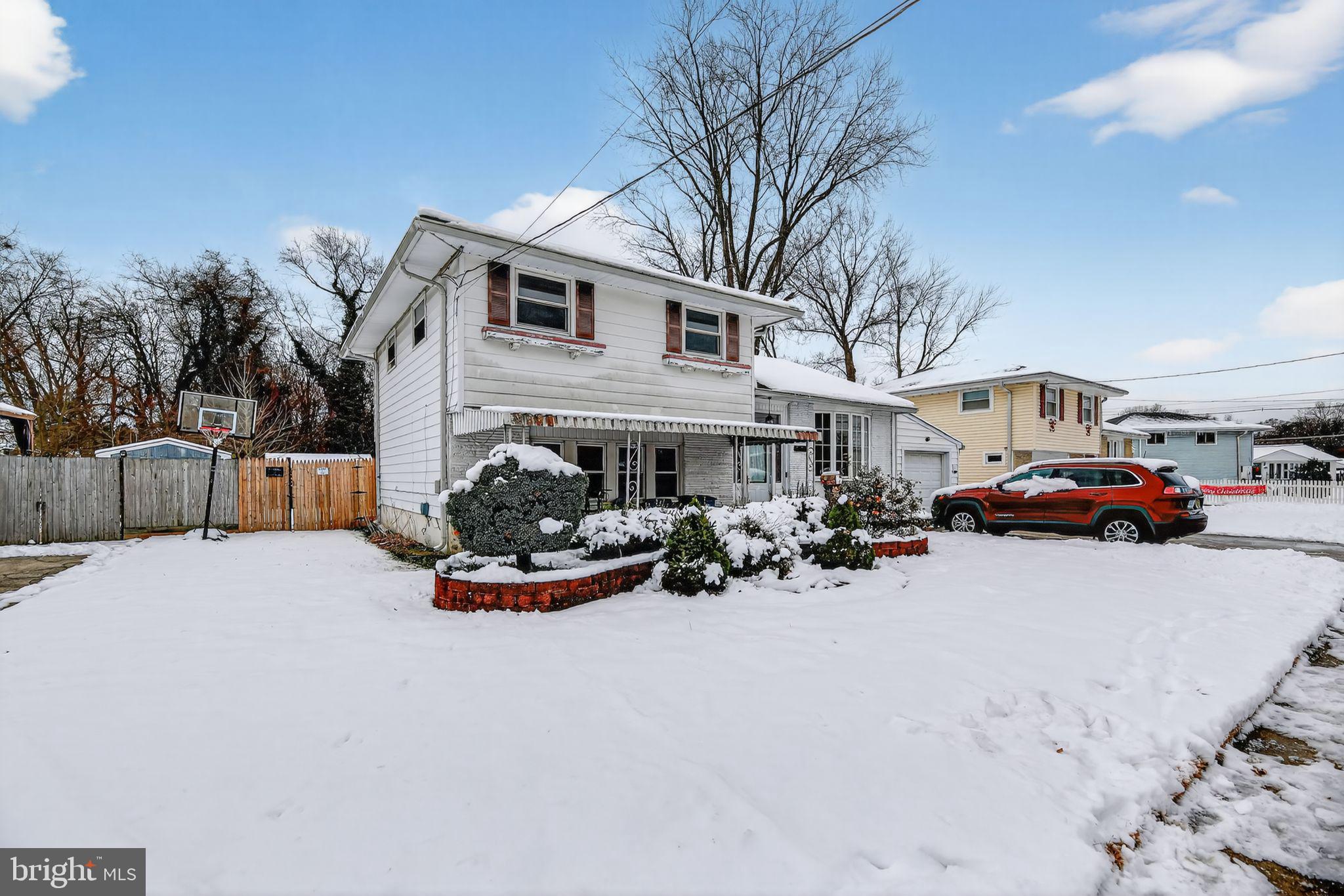 308 Smith Lane Runnemede, NJ 08078 - Photo 3 of 32 a view of a house with a yard covered with snow in front of house