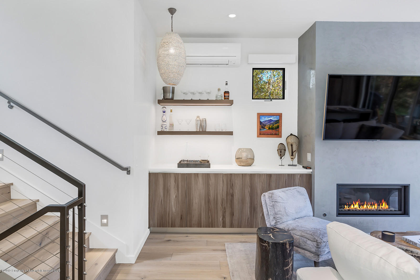 1098 Waters Avenue Aspen, CO 81611 - Photo 14 of 45 a living room with furniture and a fireplace