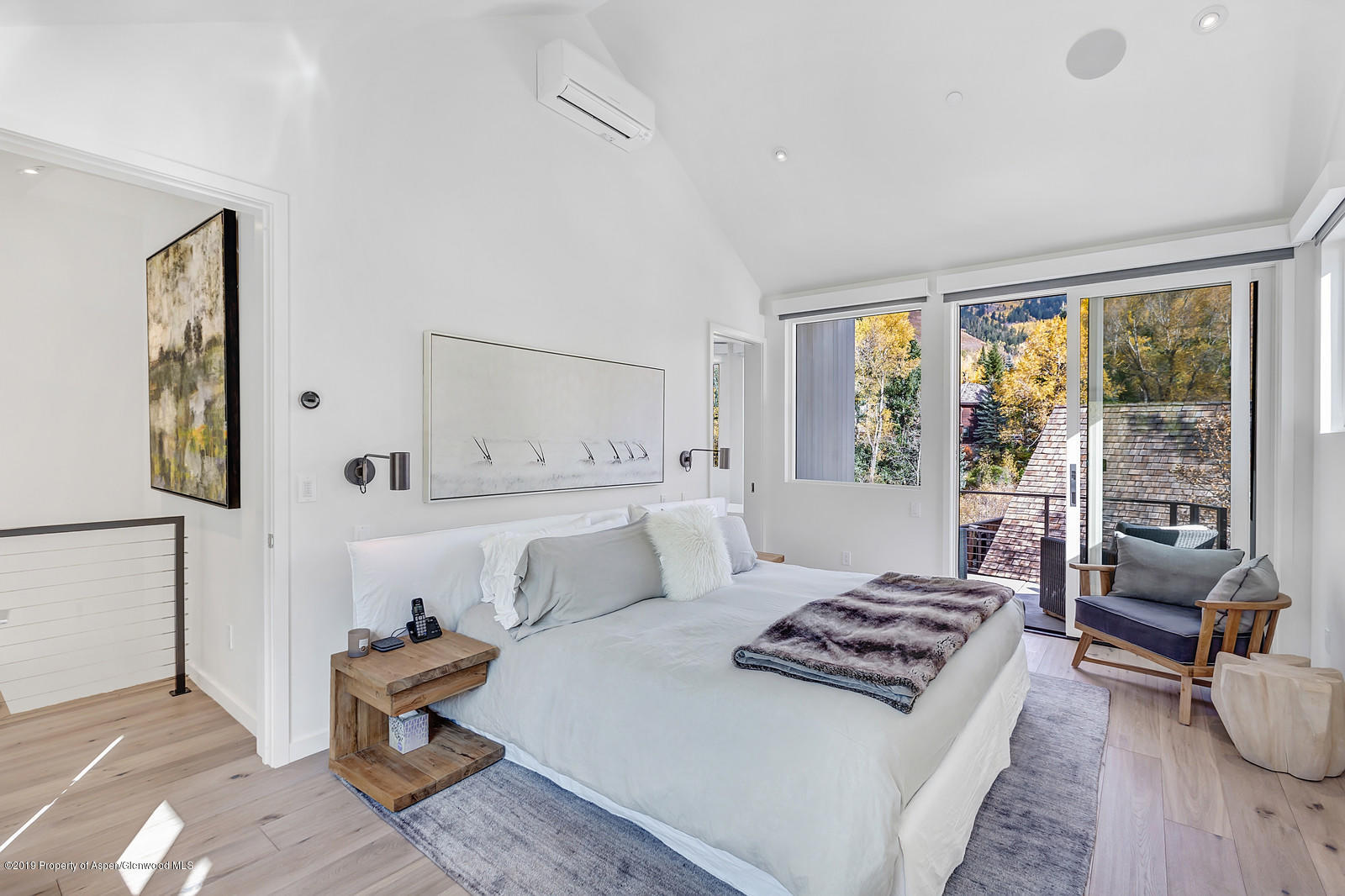 1098 Waters Avenue Aspen, CO 81611 - Photo 18 of 45 a living room with furniture and a large window