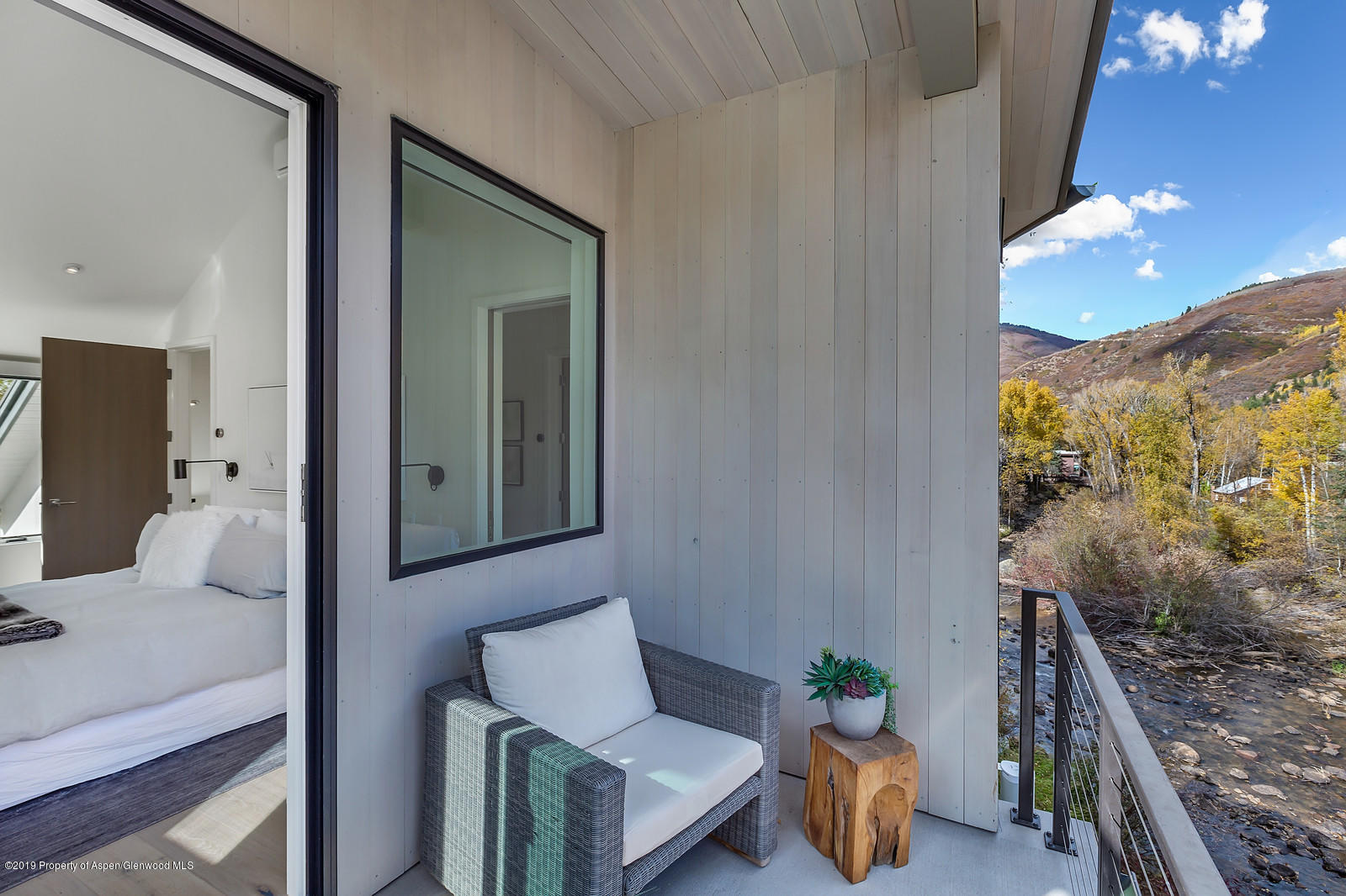 1098 Waters Avenue Aspen, CO 81611 - Photo 28 of 45 a balcony with furniture and a potted plant