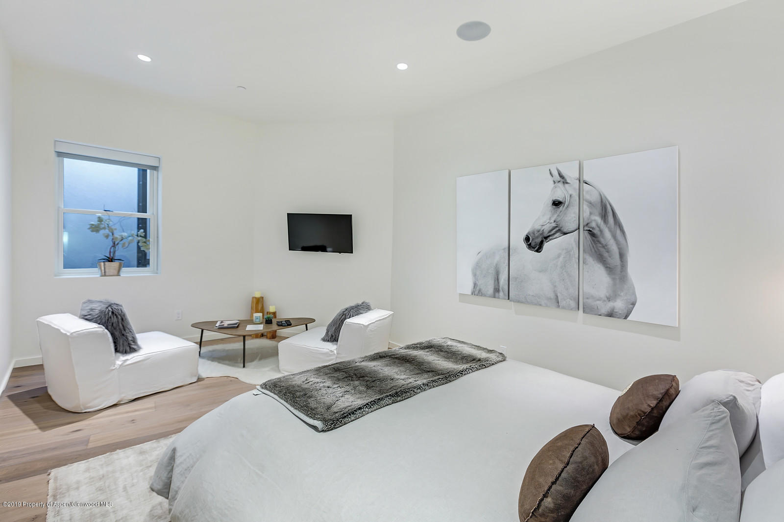 1098 Waters Avenue Aspen, CO 81611 - Photo 30 of 45 a bedroom with a bed and a couch