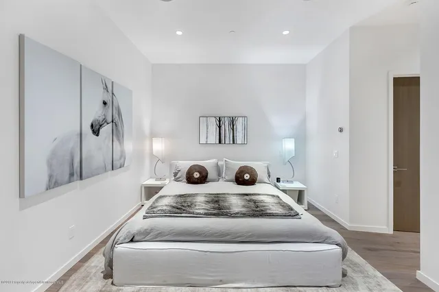 a living room with furniture and a painting