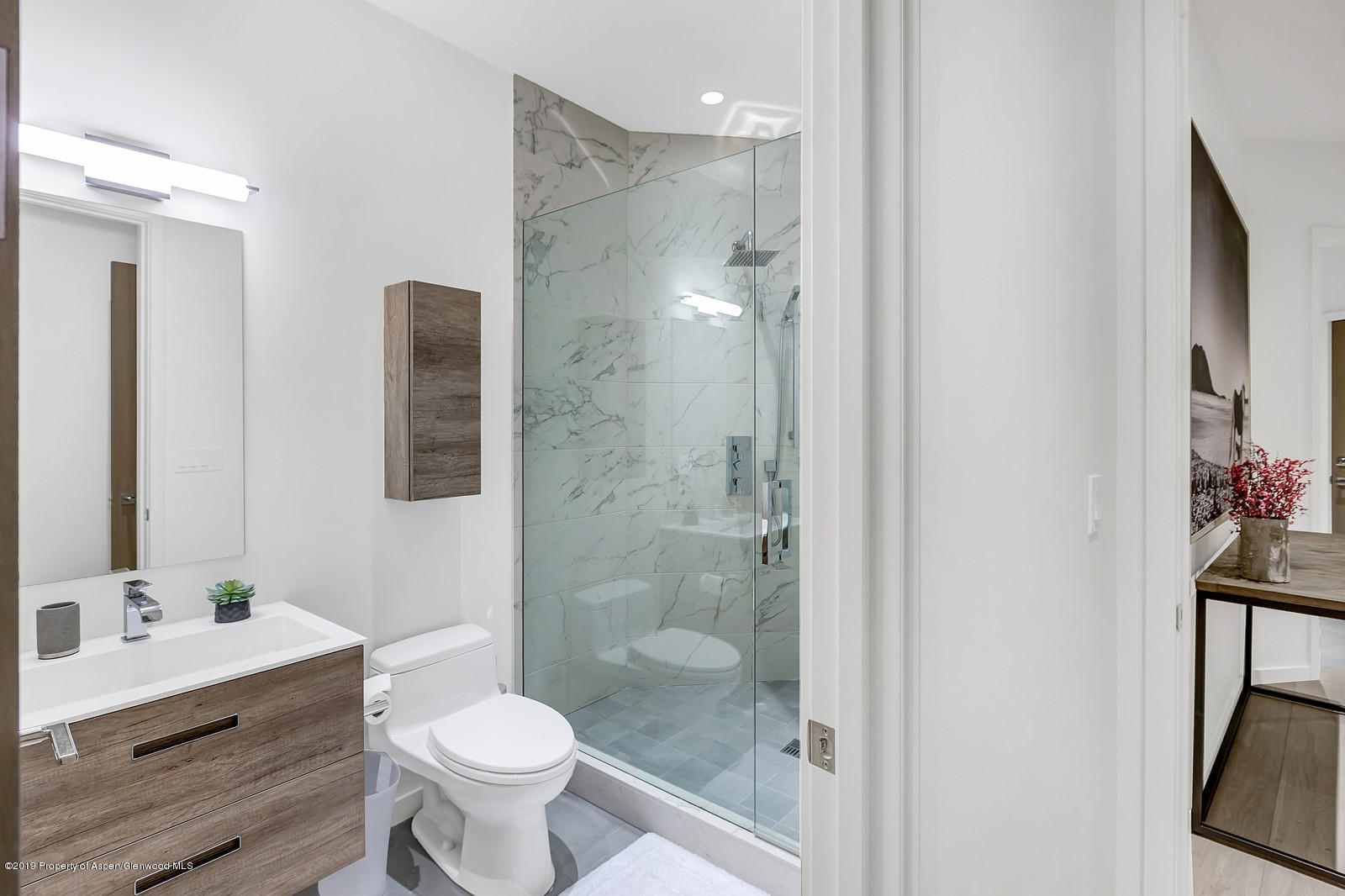 1098 Waters Avenue Aspen, CO 81611 - Photo 32 of 45 a bathroom with a sink toilet and shower