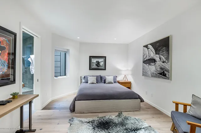 a bathroom with a toilet sink and shower