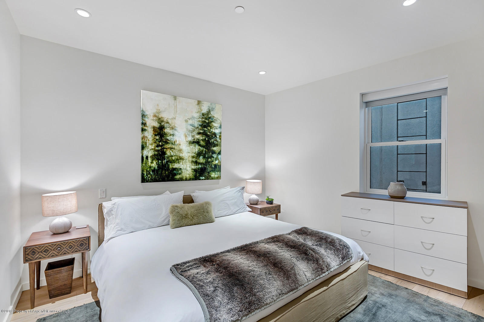 1098 Waters Avenue Aspen, CO 81611 - Photo 36 of 45 a bedroom with a bed and a window