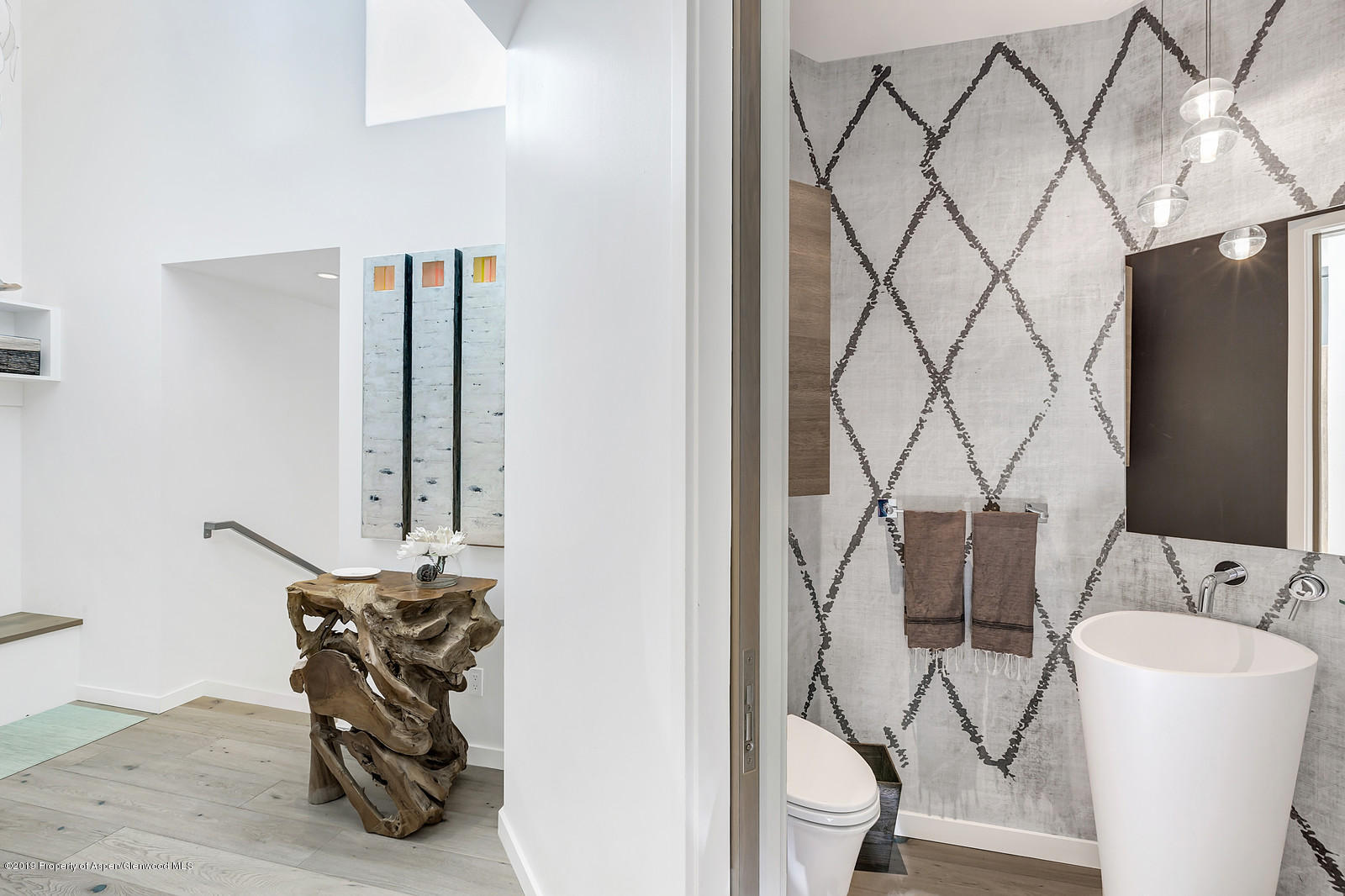 1098 Waters Avenue Aspen, CO 81611 - Photo 41 of 45 a living room with furniture and a flat screen tv