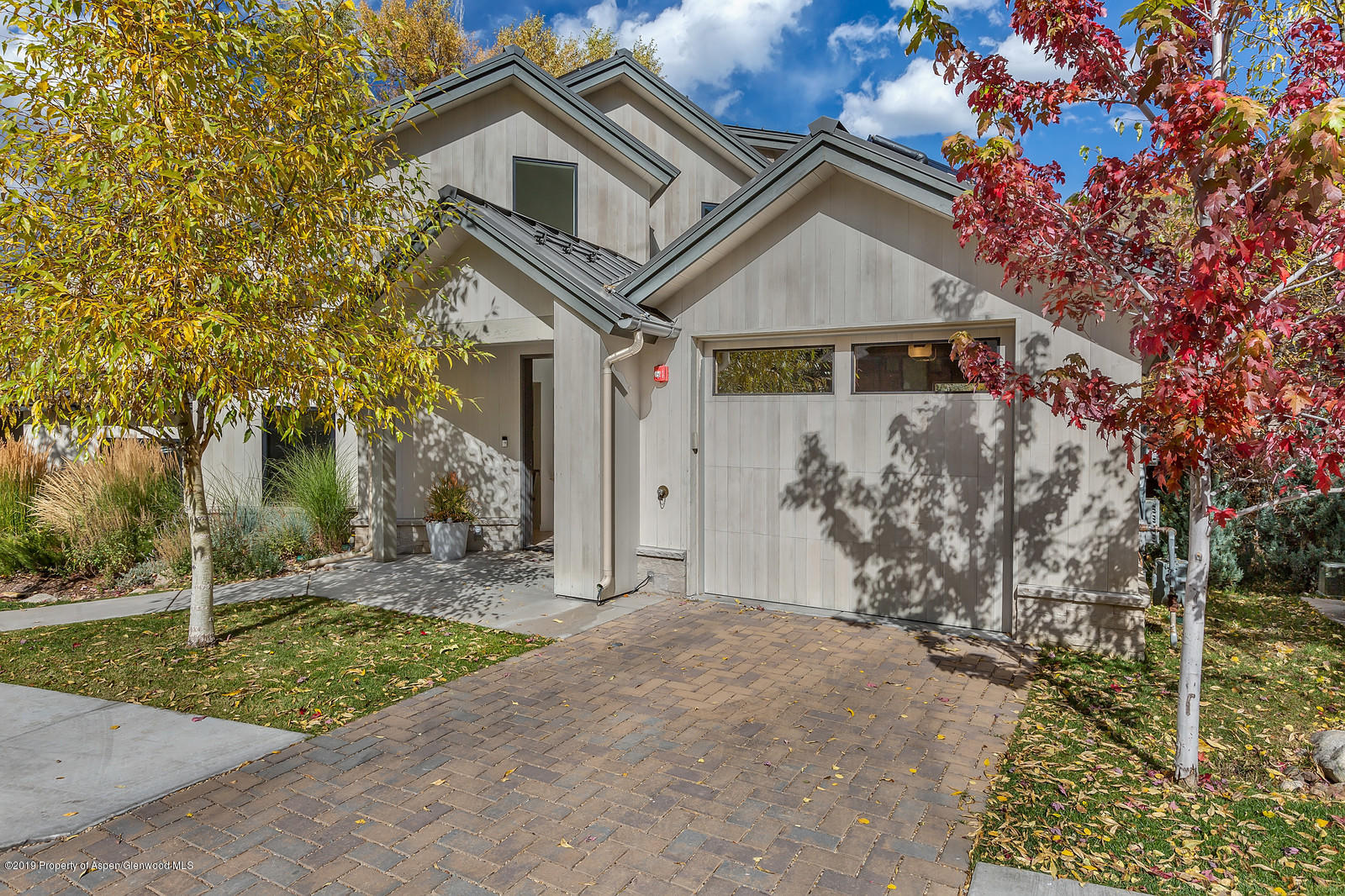1098 Waters Avenue Aspen, CO 81611 - Photo 43 of 45 a front view of a house with a yard