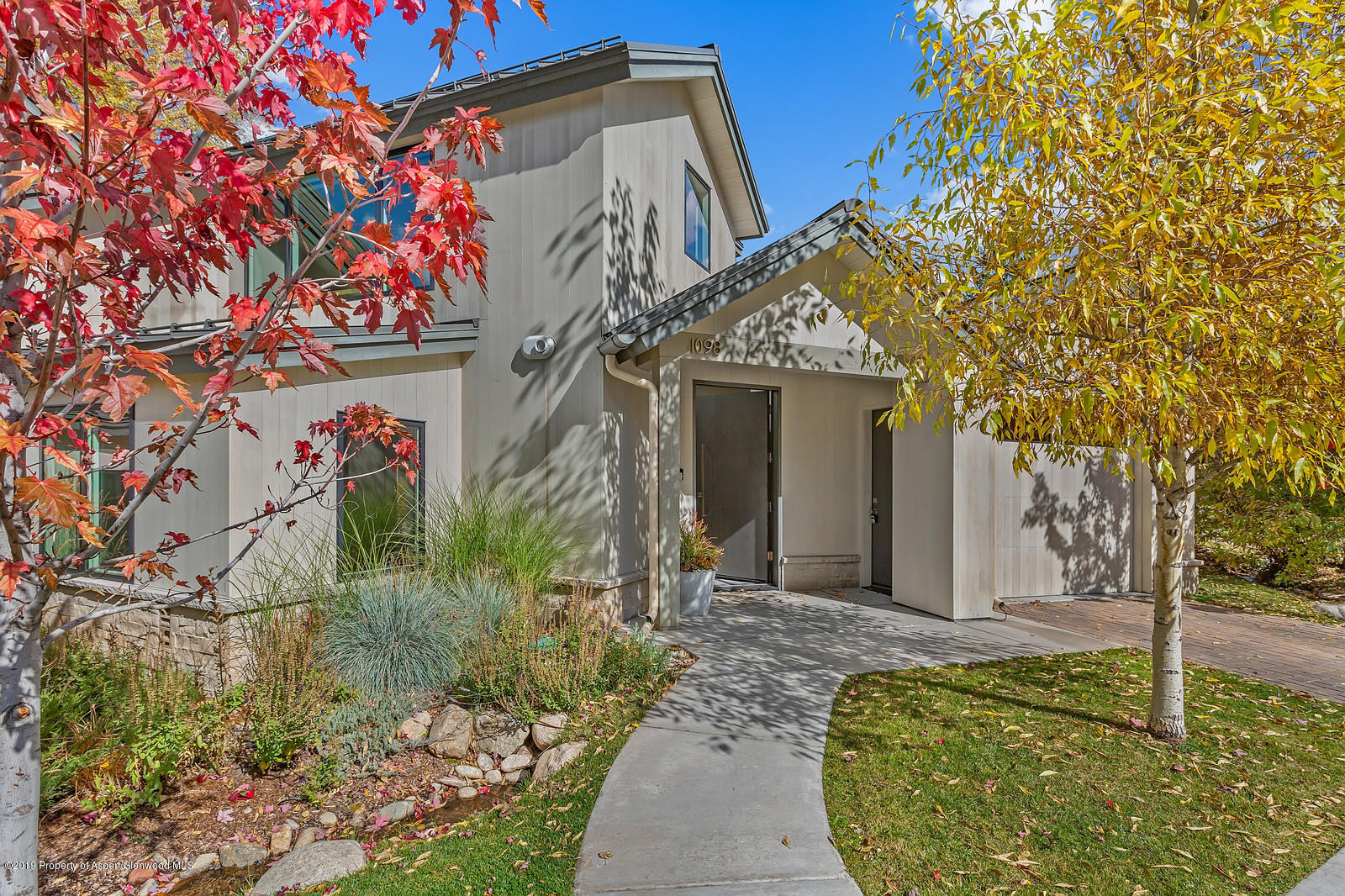 1098 Waters Avenue Aspen, CO 81611 - Photo 45 of 45 a front view of a house with a yard