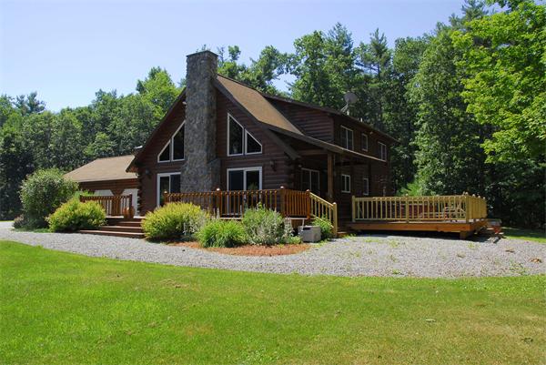 118 Groton Road Shirley, MA 01464 - Photo 1 of 15 a view of a house with a yard and potted plants
