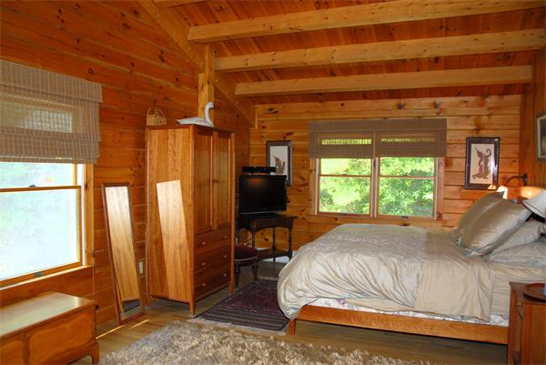 118 Groton Road Shirley, MA 01464 - Photo 13 of 15 a bed sitting in a bedroom next to a window