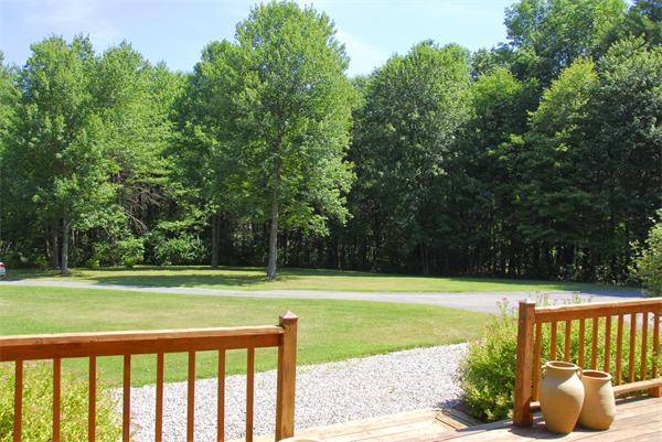 118 Groton Road Shirley, MA 01464 - Photo 5 of 15 a view of a yard with a house and large trees
