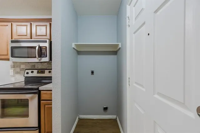 a kitchen with a stove and a microwave