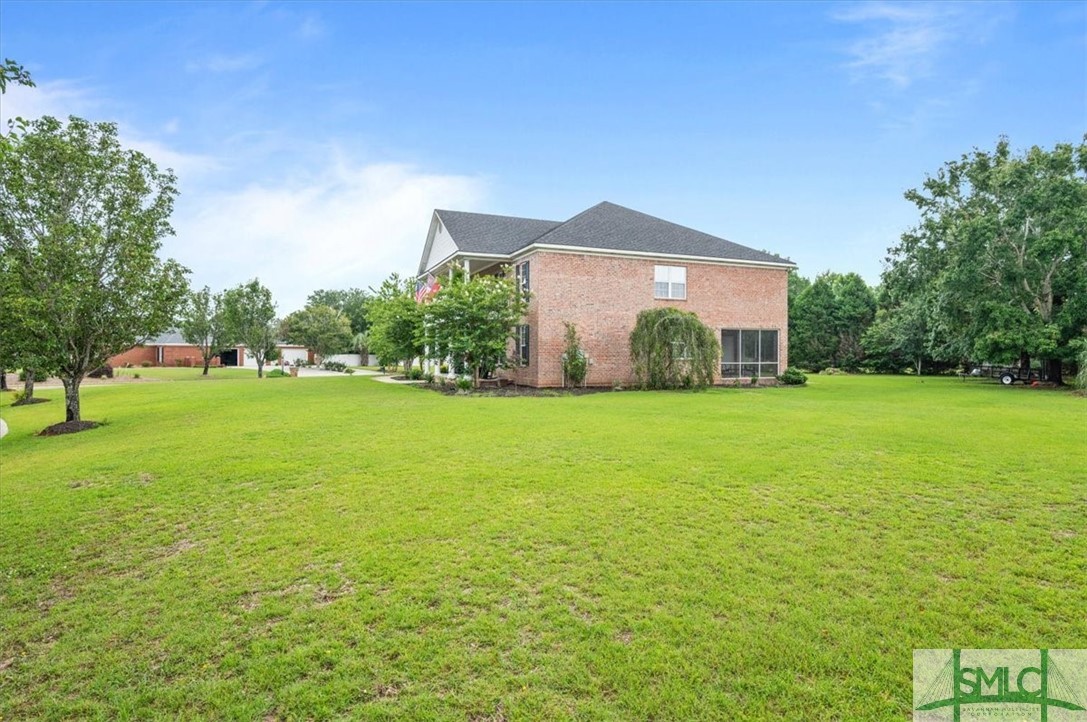 111 Stadium Drive Guyton, GA 31312 - Photo 45 of 50 Tons of Yard ~ Fire Pit