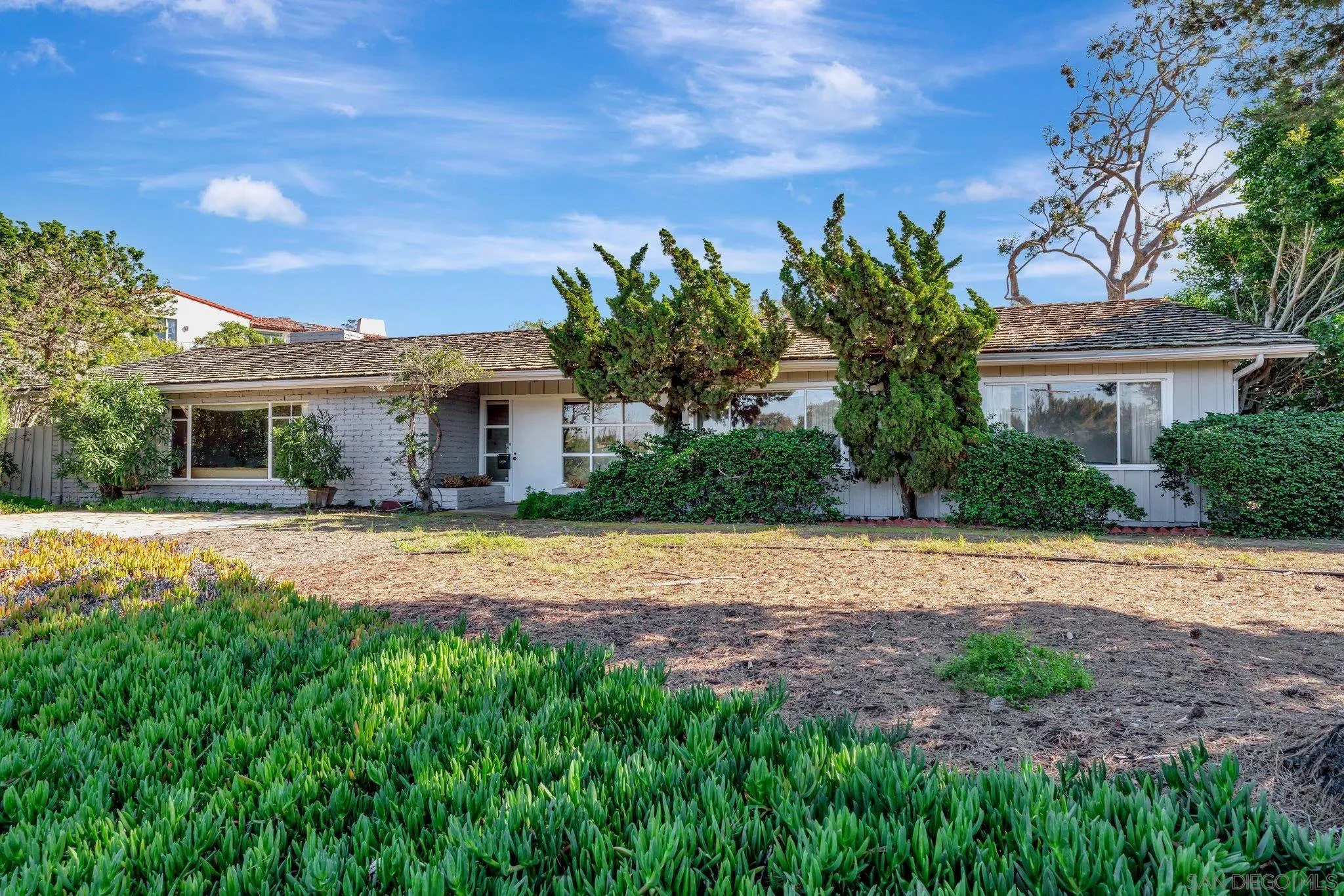 1351 Rhoda Drive La Jolla, CA 92037 - Photo 6 of 20 a house with palm tree in front of it