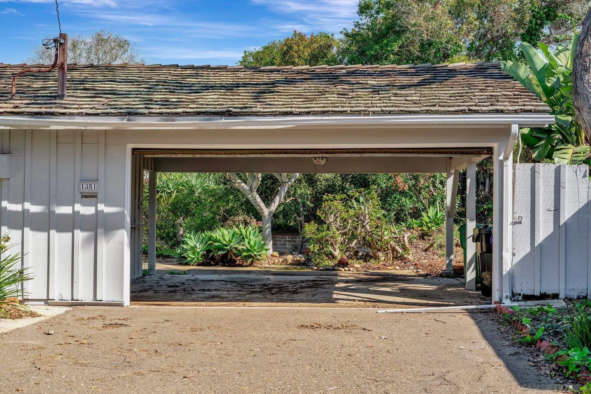 1351 Rhoda Drive La Jolla, CA 92037 - Photo 7 of 20 a front view of a house with a garden