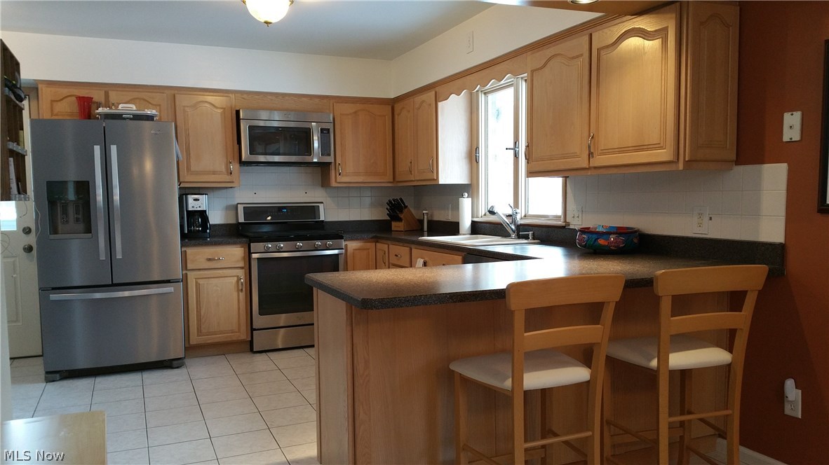 9448 Avery Road Broadview Heights, OH 44147 - Photo 5 of 32 Plenty of Counters and cabinets* Breakfast Bar