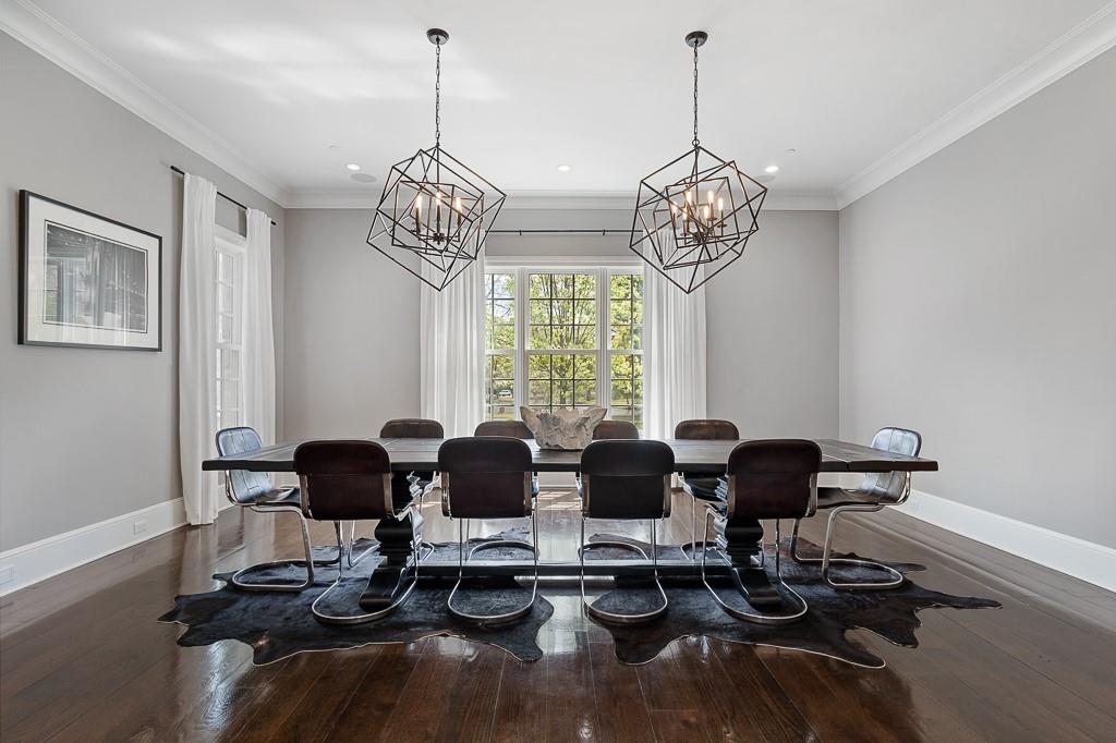1 Duck Pond Road Scarsdale, NY 10583 - Photo 12 of 48 a view of a dining room with furniture wooden floor and chandelier