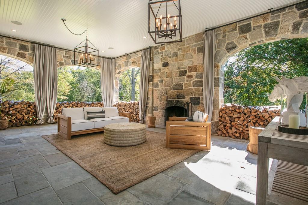 1 Duck Pond Road Scarsdale, NY 10583 - Photo 20 of 48 a living room with furniture and a fireplace