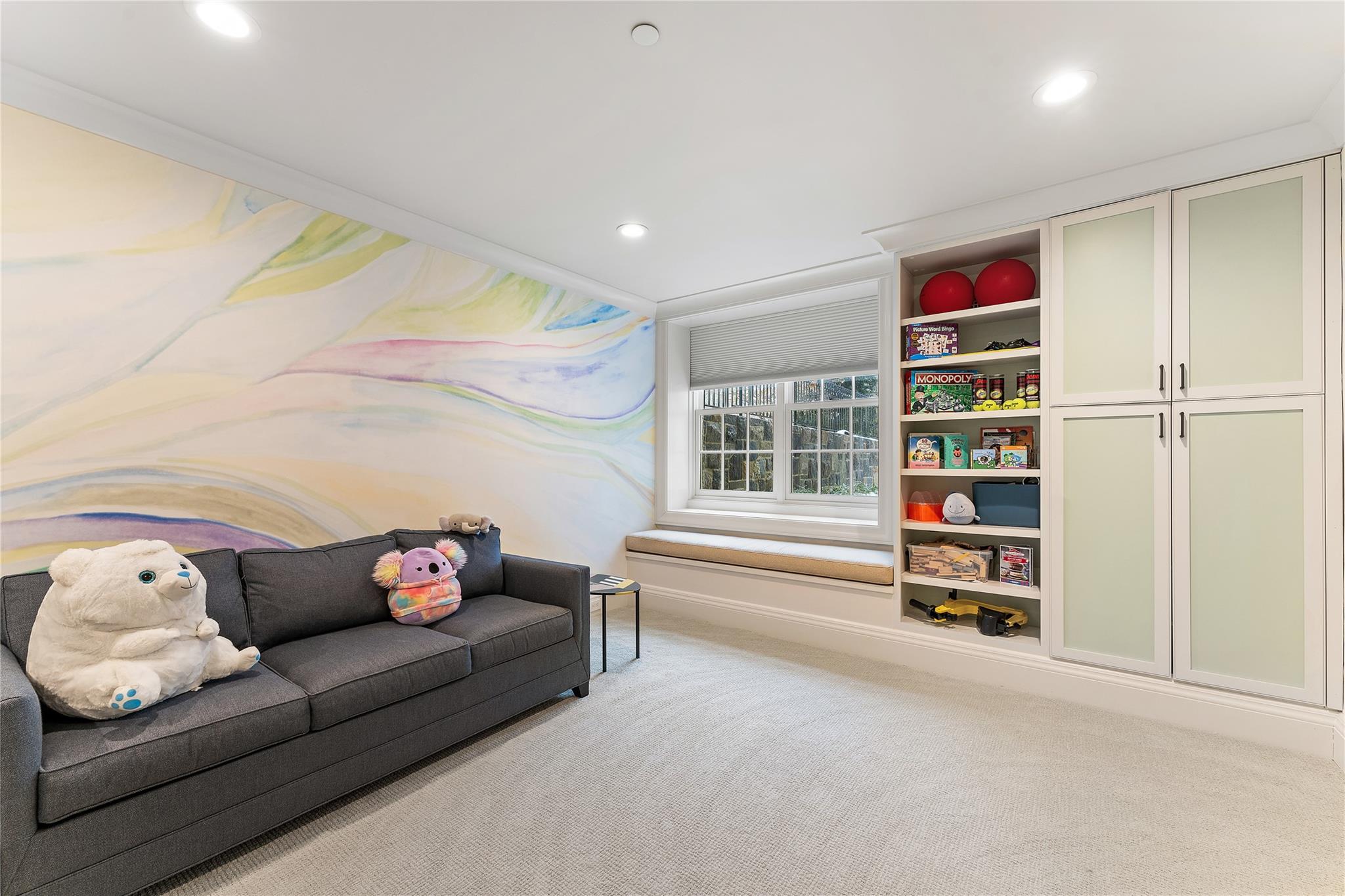 1 Duck Pond Road Scarsdale, NY 10583 - Photo 40 of 48 a living room with furniture and a book shelf