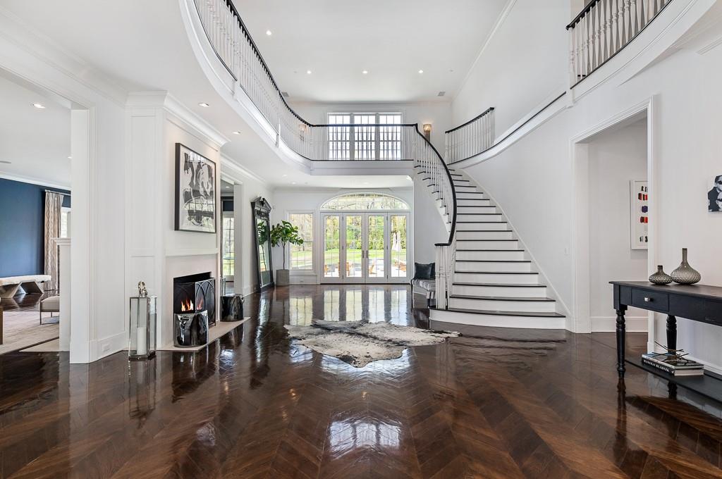 1 Duck Pond Road Scarsdale, NY 10583 - Photo 4 of 48 a dinning room with wooden floor and windows