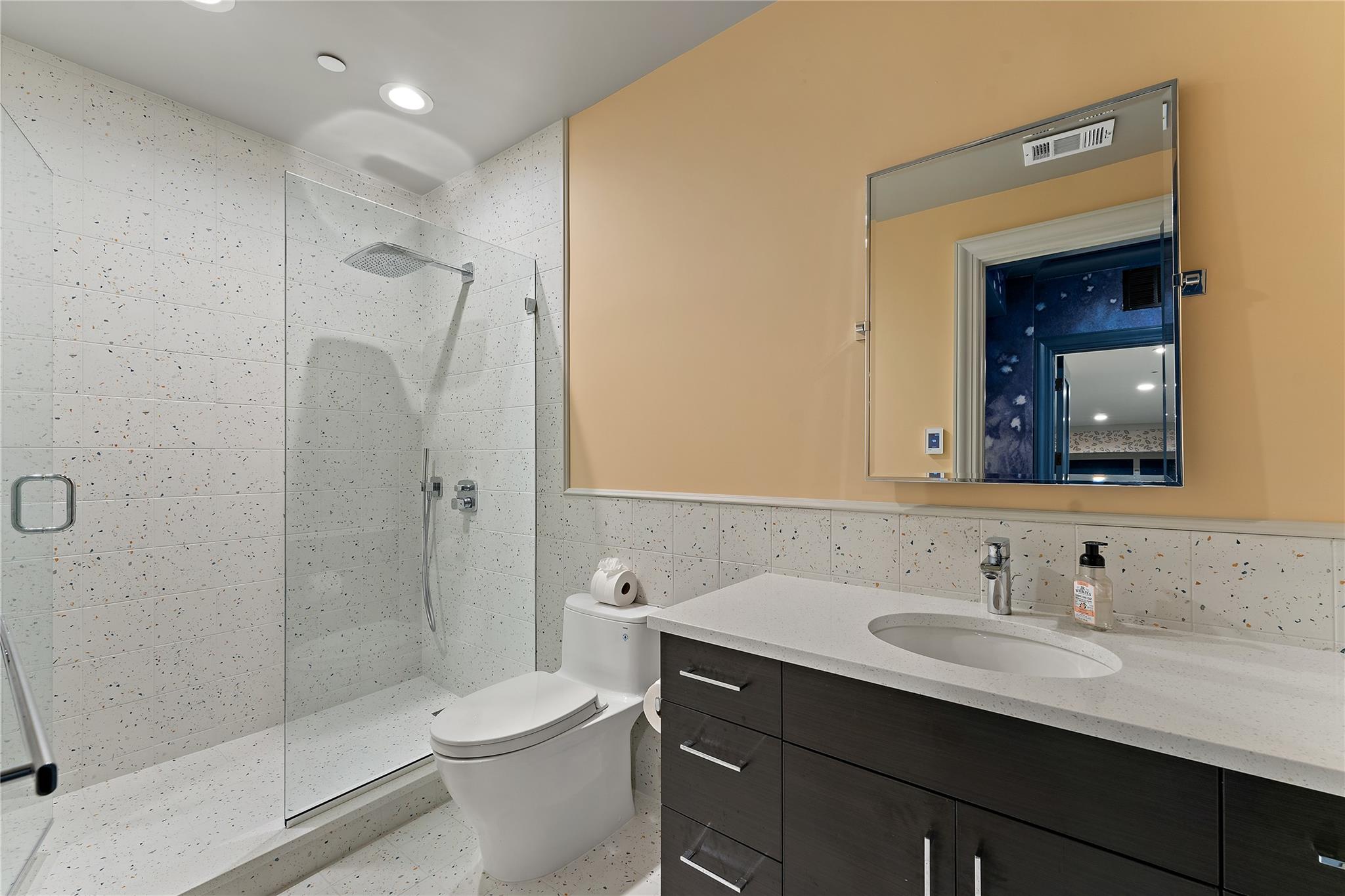 1 Duck Pond Road Scarsdale, NY 10583 - Photo 42 of 48 a bathroom with a sink a toilet and shower