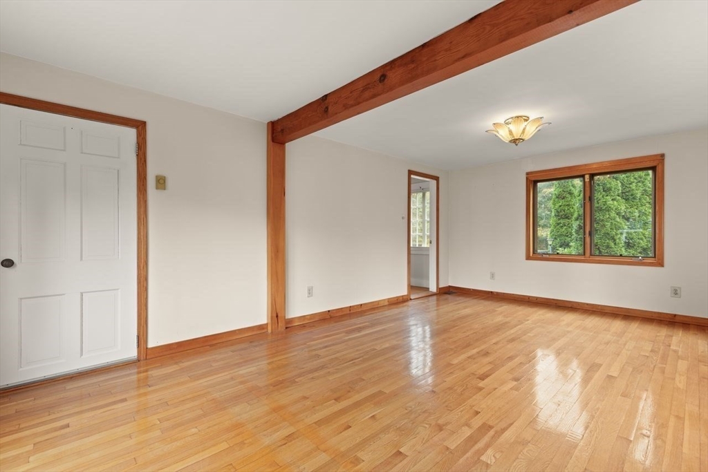 10 Oak Street Wareham, MA 02571 - Photo 12 of 39 an empty room with wooden floor and windows