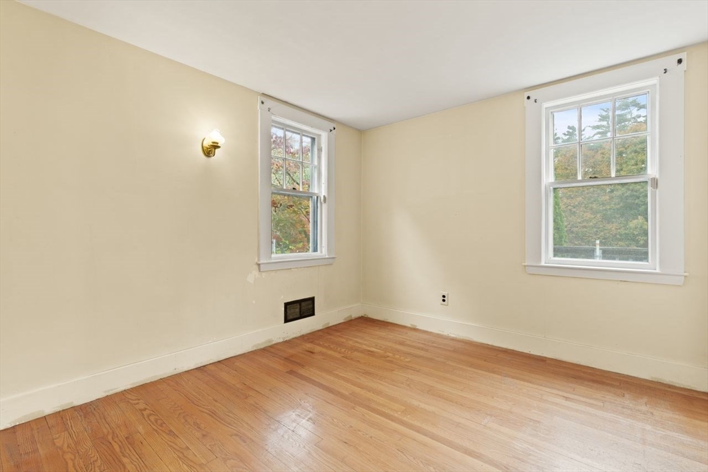 10 Oak Street Wareham, MA 02571 - Photo 13 of 39 wooden floor in an empty room with a window