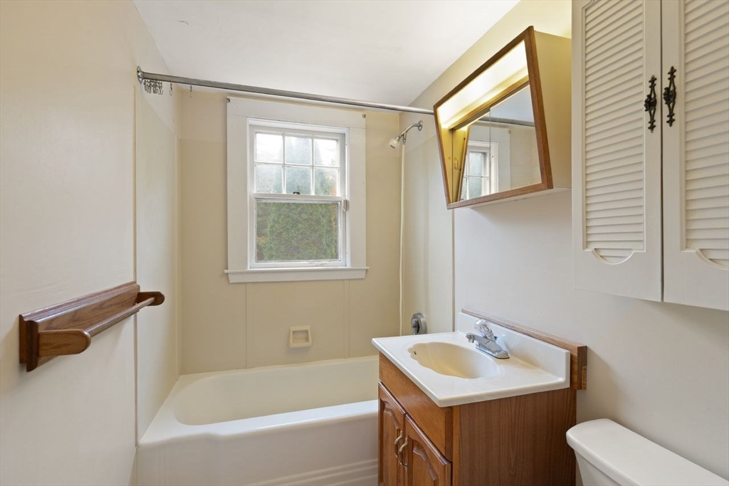 10 Oak Street Wareham, MA 02571 - Photo 14 of 39 a bathroom with a sink toilet and mirror