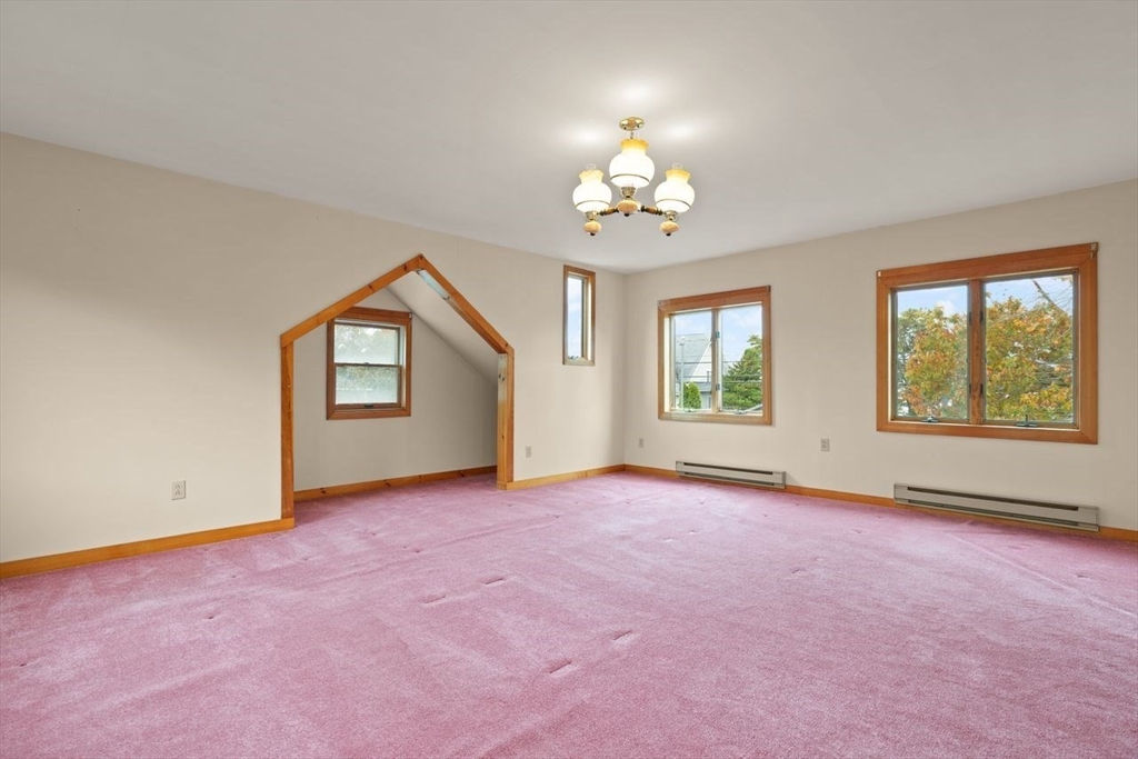 10 Oak Street Wareham, MA 02571 - Photo 17 of 39 an empty room with windows and ceiling fan