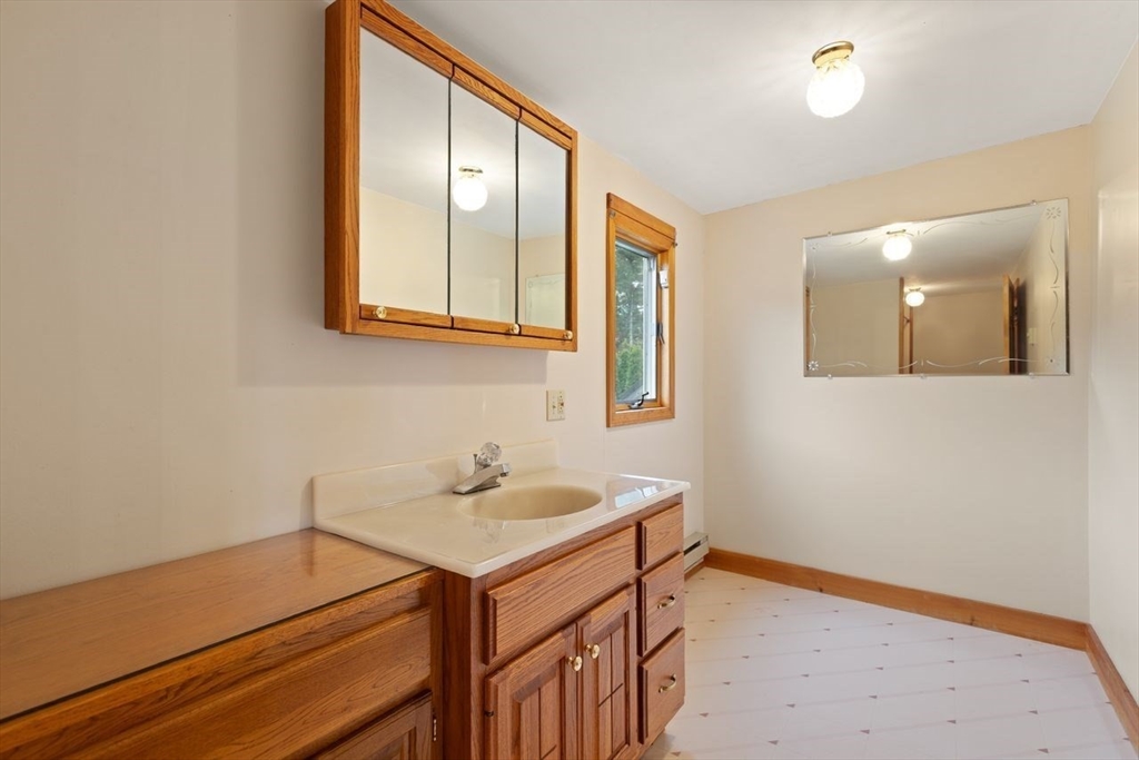 10 Oak Street Wareham, MA 02571 - Photo 22 of 39 a bathroom with a sink and a mirror