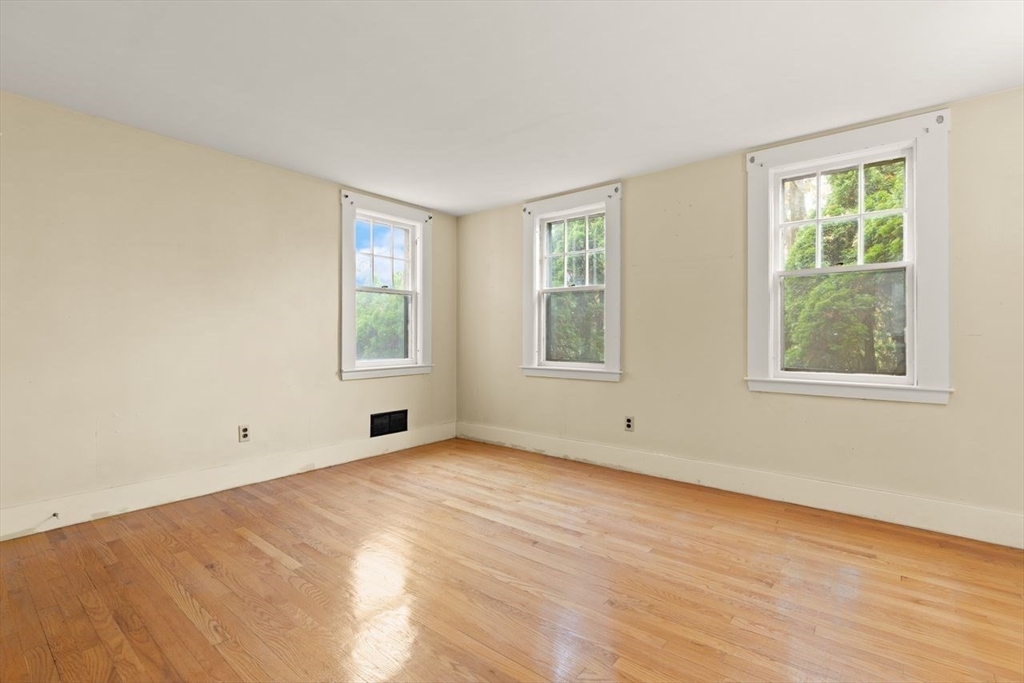 10 Oak Street Wareham, MA 02571 - Photo 7 of 39 a view of empty room with wooden floor and fan