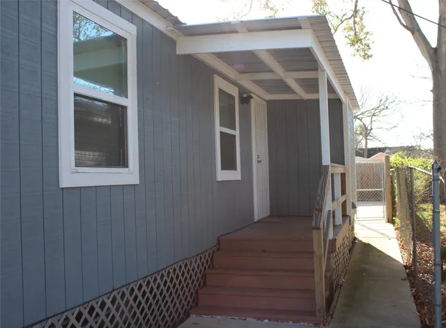 a kitchen with a refrigerator and a sink