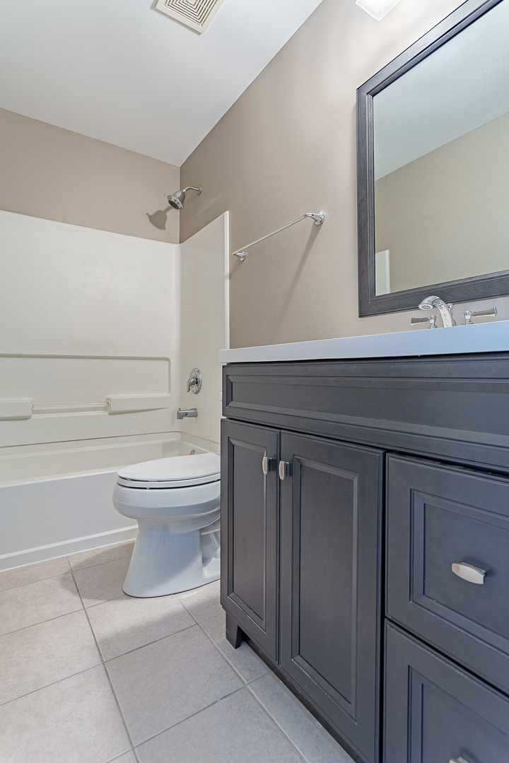 133 Willey Street Gilberts, IL 60136 - Photo 13 of 21 a bathroom with a toilet sink and mirror