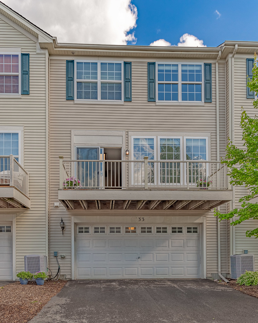 133 Willey Street Gilberts, IL 60136 - Photo 21 of 21 a tall building with a lot of windows