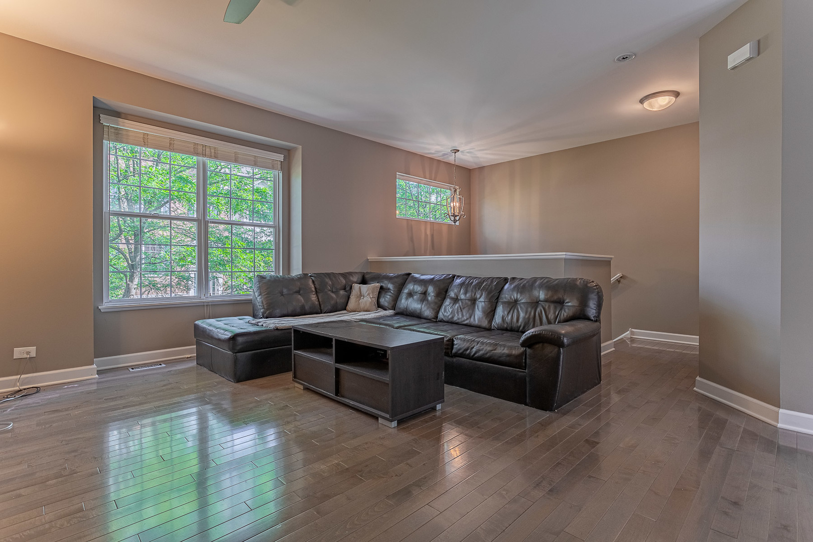 133 Willey Street Gilberts, IL 60136 - Photo 8 of 21 a large living room with a couch and a table