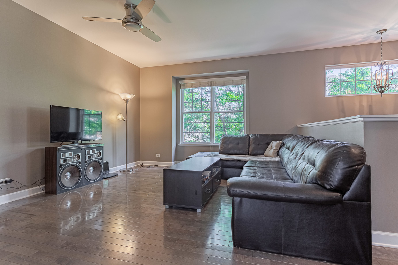 133 Willey Street Gilberts, IL 60136 - Photo 9 of 21 a living room with furniture a flat screen tv and a window