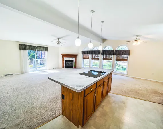 a kitchen with a stove and a kitchen island