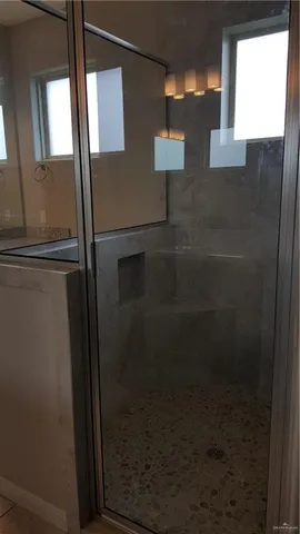 a bathroom with a granite countertop sink a toilet and bathtub
