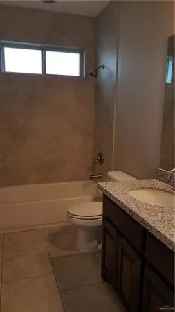 a view of an empty room with a cabinet