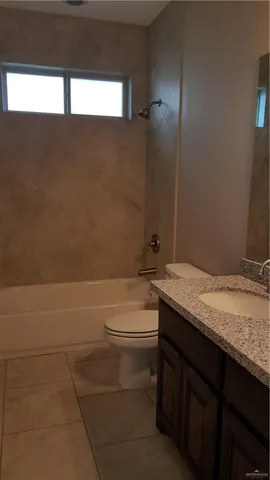 a view of an empty room with a cabinet