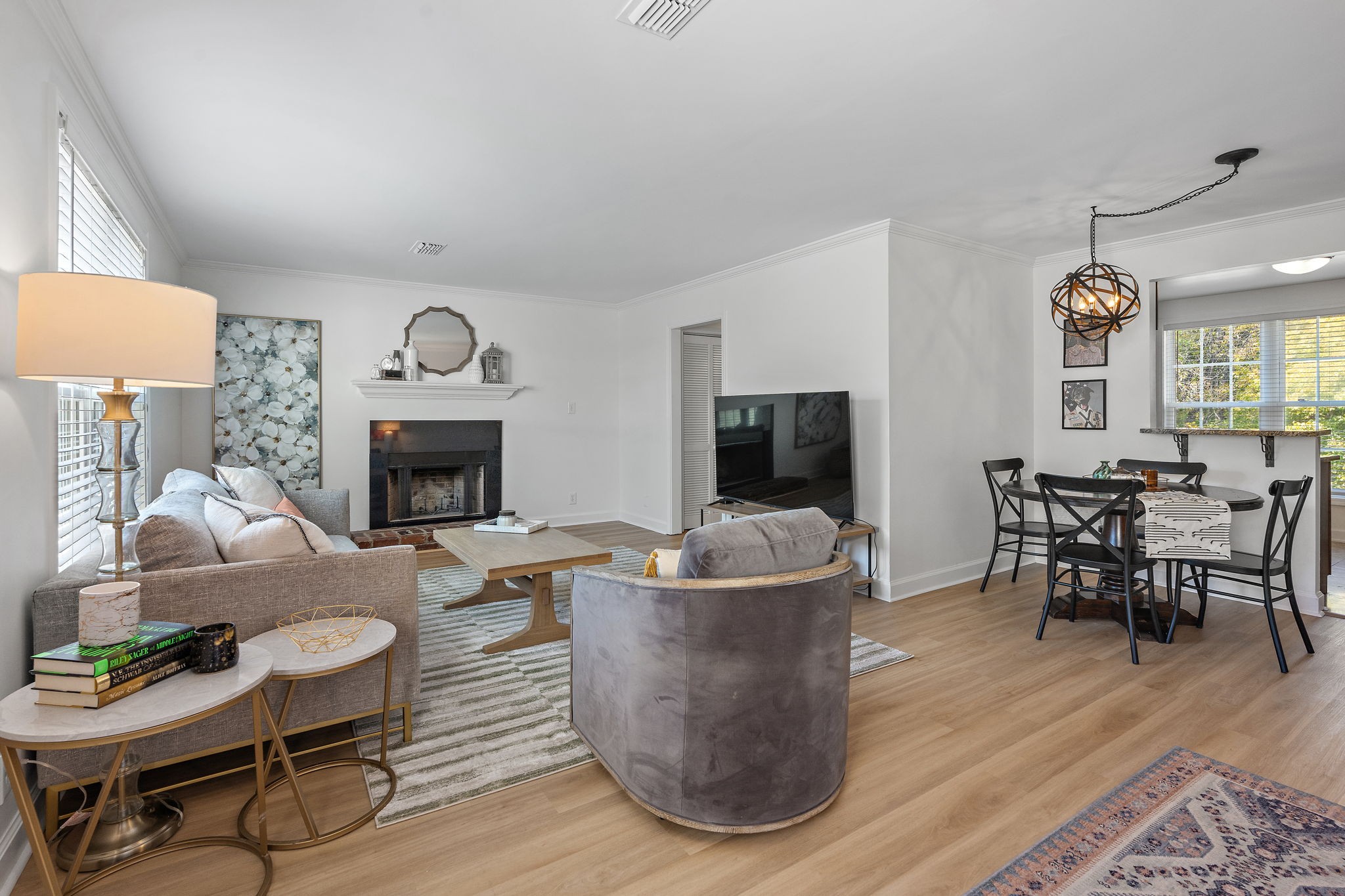 1082 General George Patton Road Nashville, TN 37221 - Photo 1 of 21 a living room with furniture a flat screen tv and a fireplace