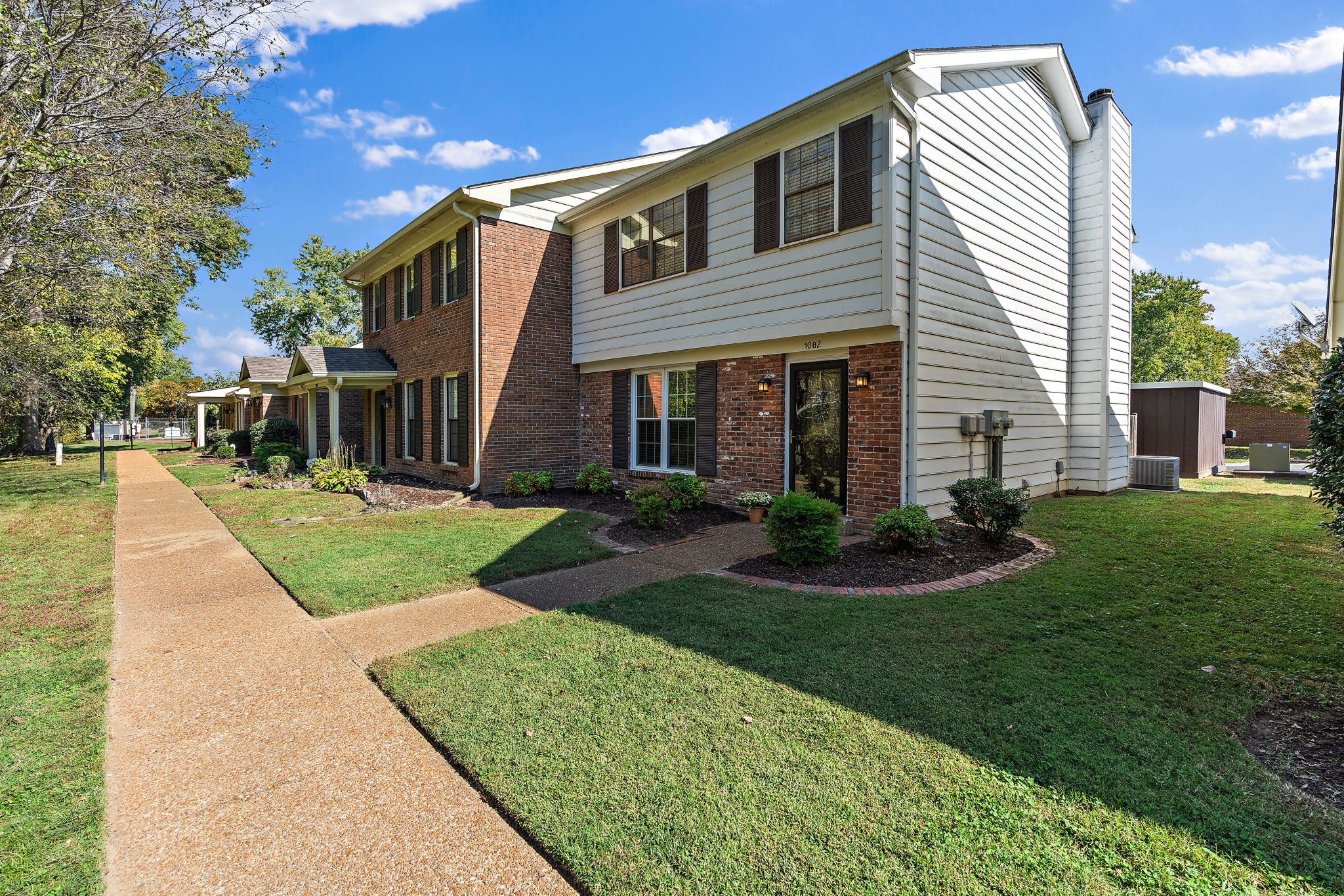 1082 General George Patton Road Nashville, TN 37221 - Photo 3 of 21 a front view of a house with garden and trees