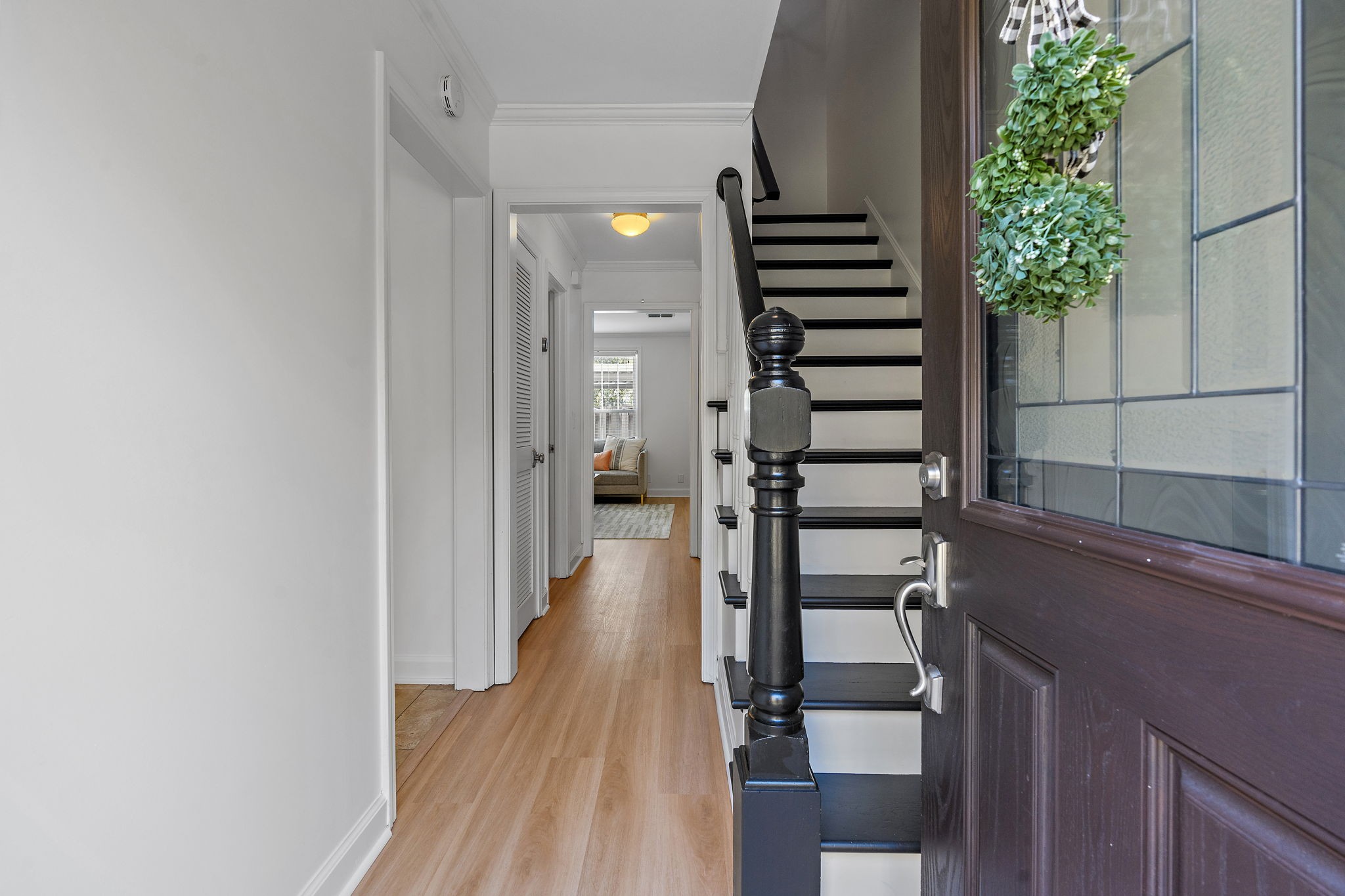 1082 General George Patton Road Nashville, TN 37221 - Photo 4 of 21 a view of a hallway with wooden floor and stairs