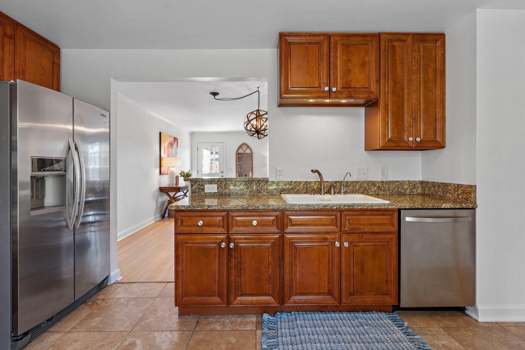 1082 General George Patton Road Nashville, TN 37221 - Photo 7 of 21 a kitchen with stainless steel appliances granite countertop a sink and a refrigerator