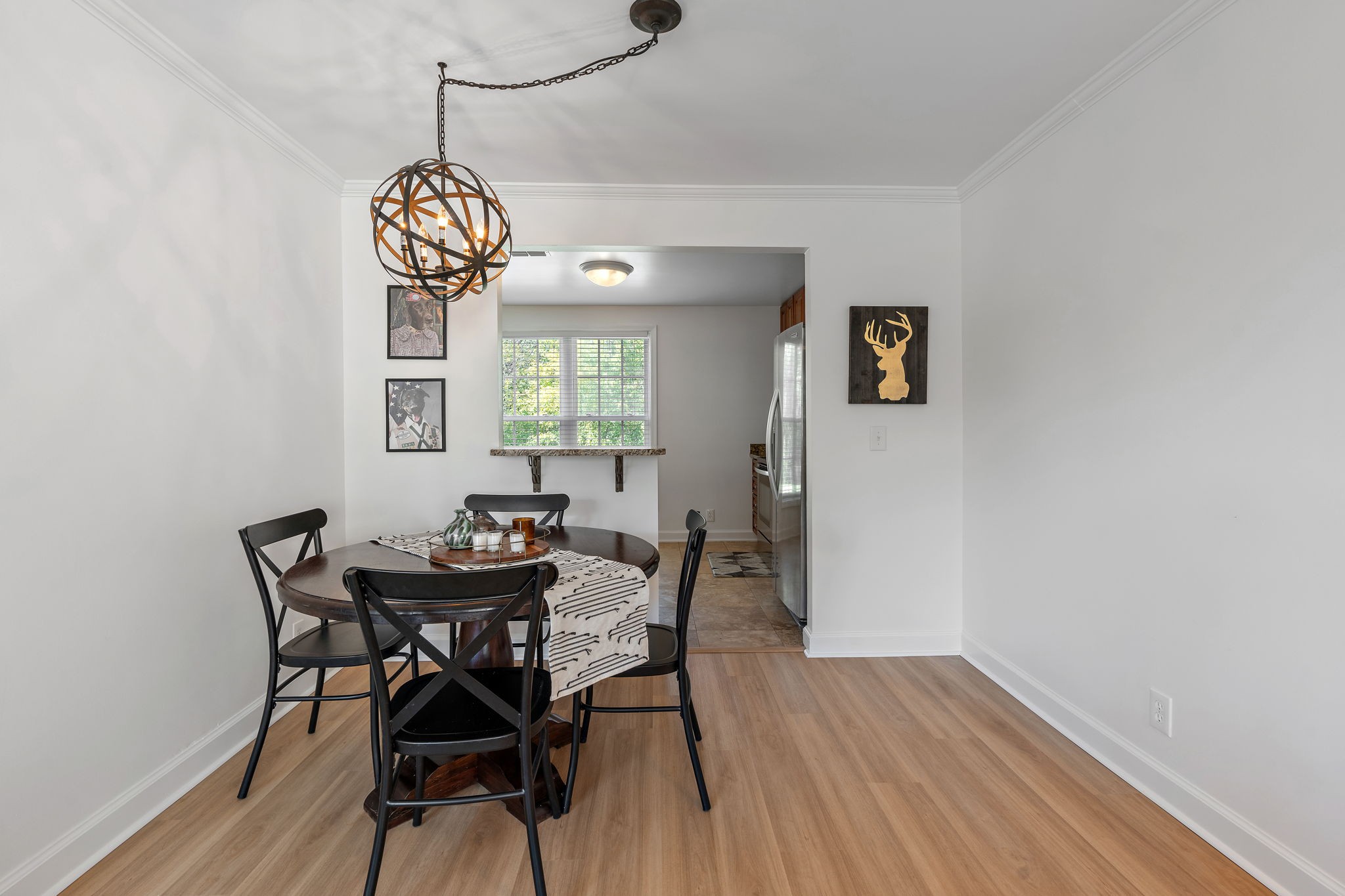 1082 General George Patton Road Nashville, TN 37221 - Photo 8 of 21 a view of a dining room with furniture wooden floor and chandelier
