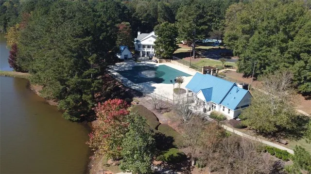 a view of a roof deck with couches and wooden floor